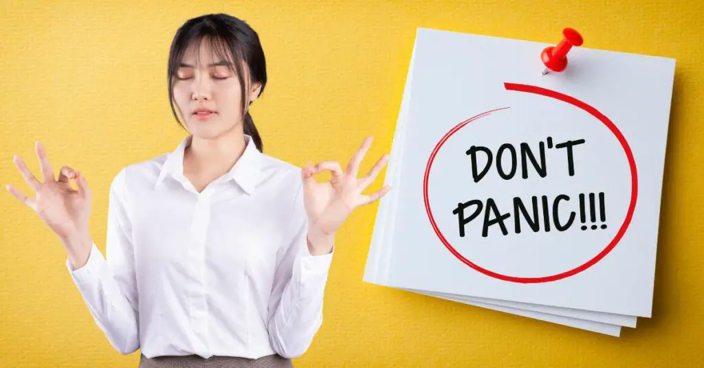 A woman holding a piece of paper with the words "don't panic" seeks advice on how to fight a chargeback.