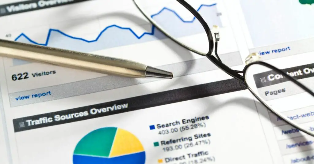 A pair of glasses and a pen on top of a graph highlighting the advantages of evergreen content.