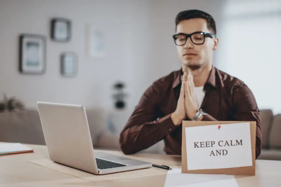 How to Respond to Negative Reviews - A man keeping calm in front of his laptop